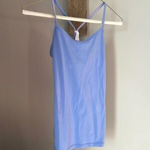 Selling 3 Girls size 14 Ivivva tanks. Lilac one with straps has a built in bra